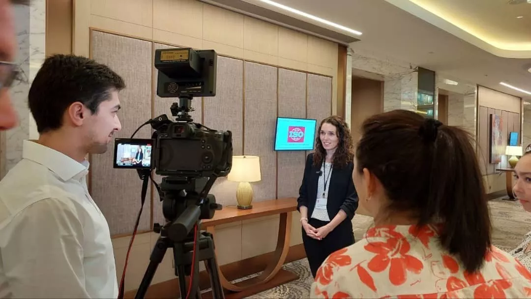 Michelle Parkouda is being interviewed on camera by a reporter at the UN Michelle Parkouda is being interviewed on camera by a reporter at the UN